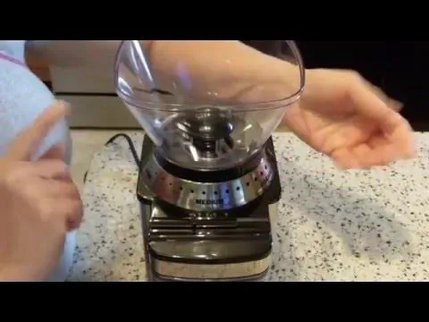 How to Clean a Cuisinart Coffee Grinder: Simple Routine A collection of cleaning tools including brushes and a microfiber cloth for coffee grinders.